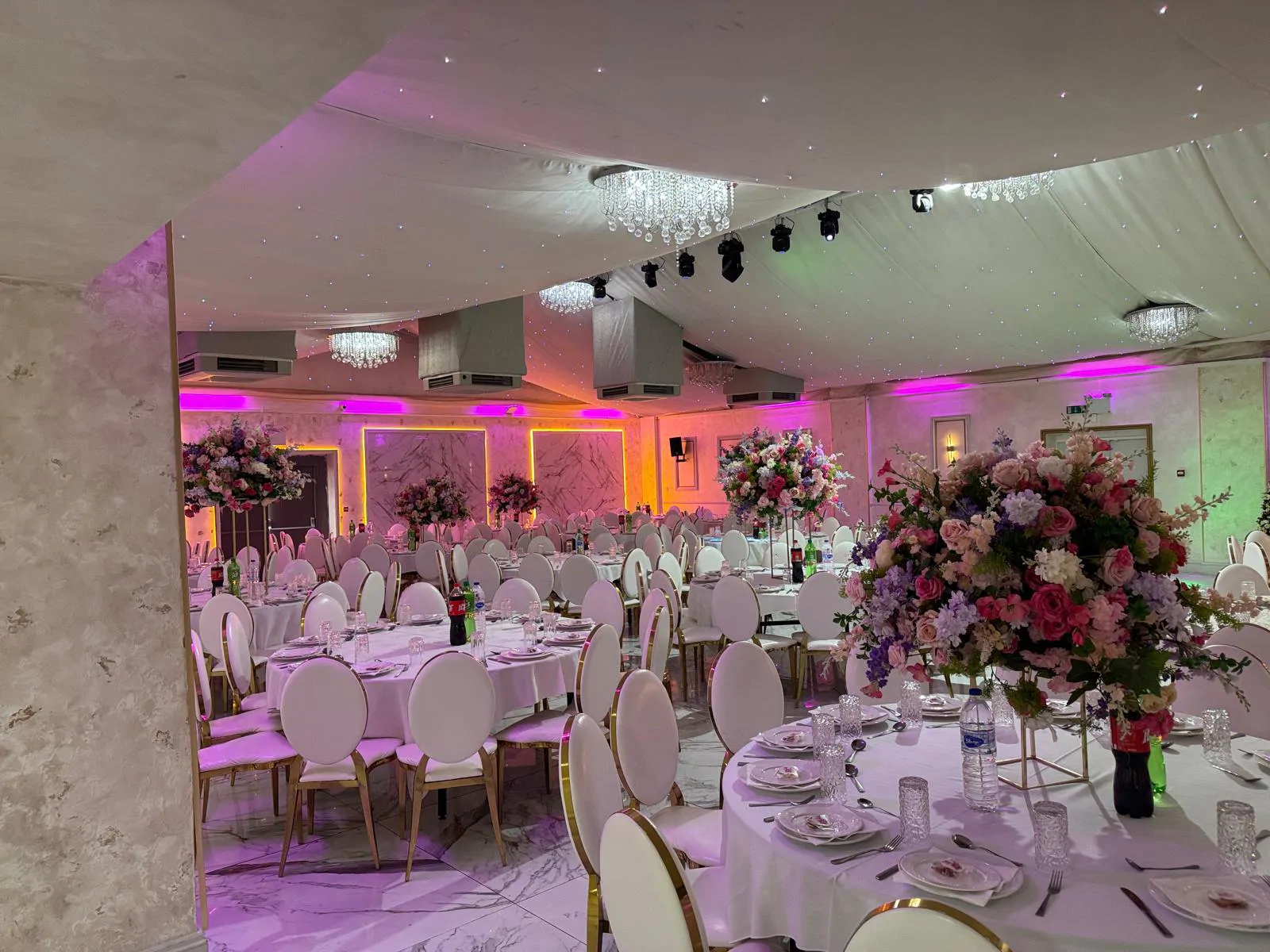 Rio Grande hall with chandeliers and round tables